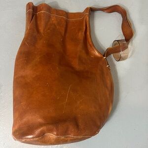 Daina Broussard Distressed Leather Bucket Bag